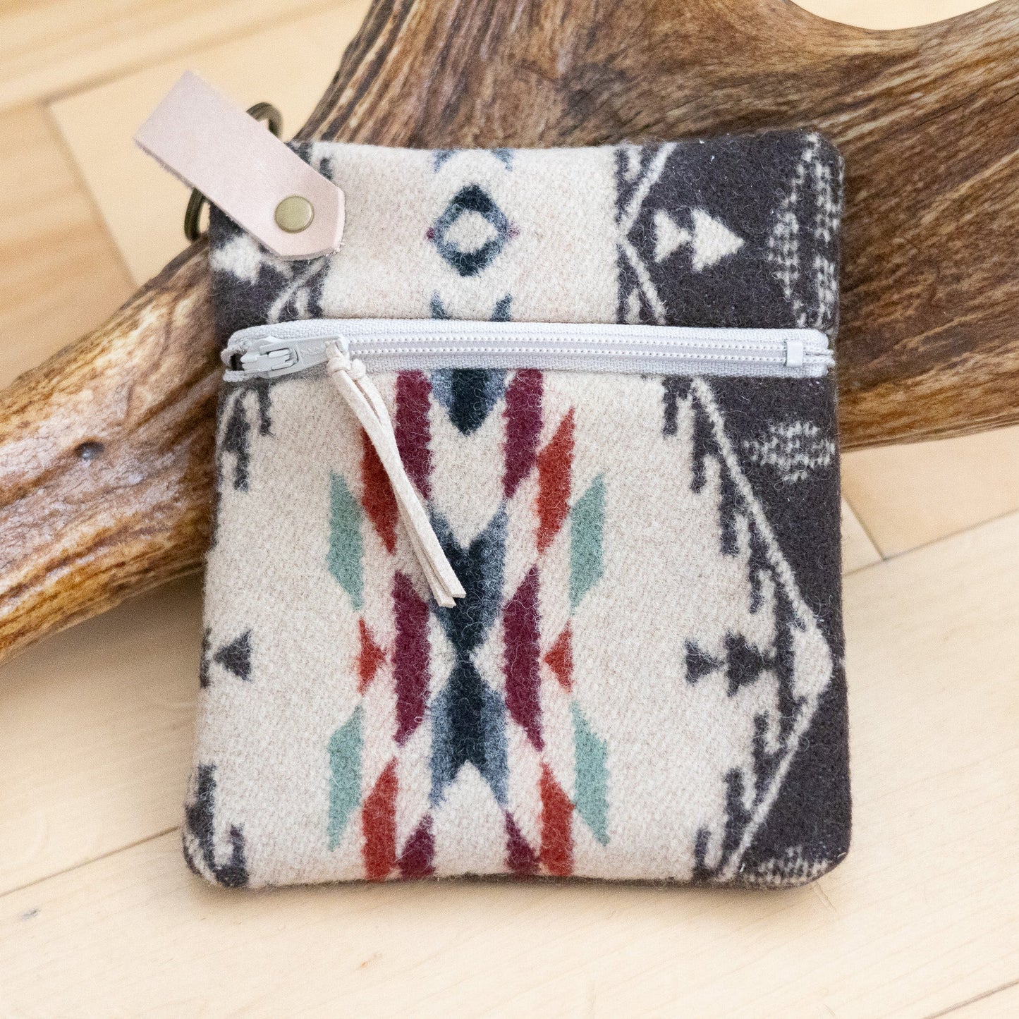 Small pouch with tribal pattern on a wooden surface