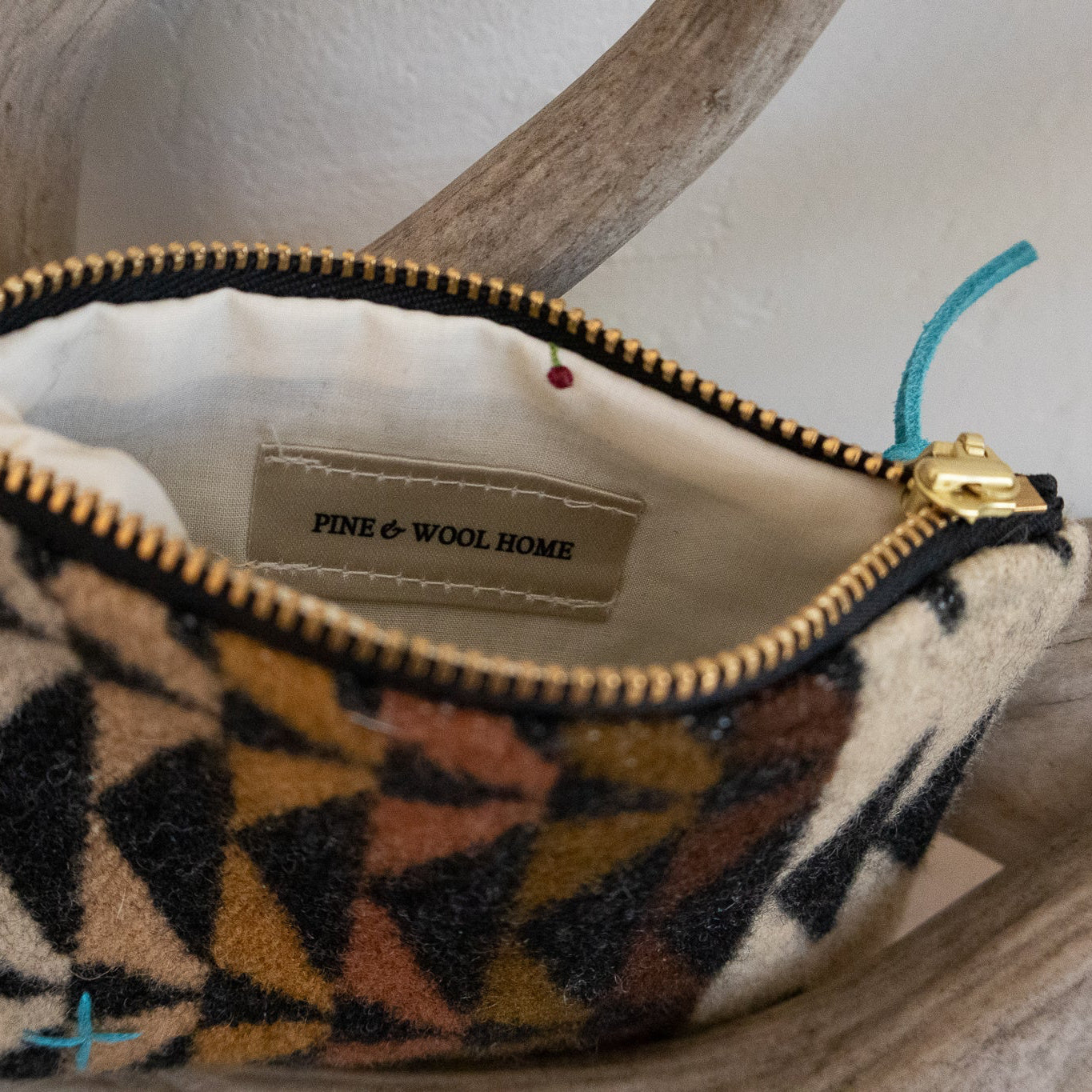 Small pouch with geometric pattern on a wooden surface