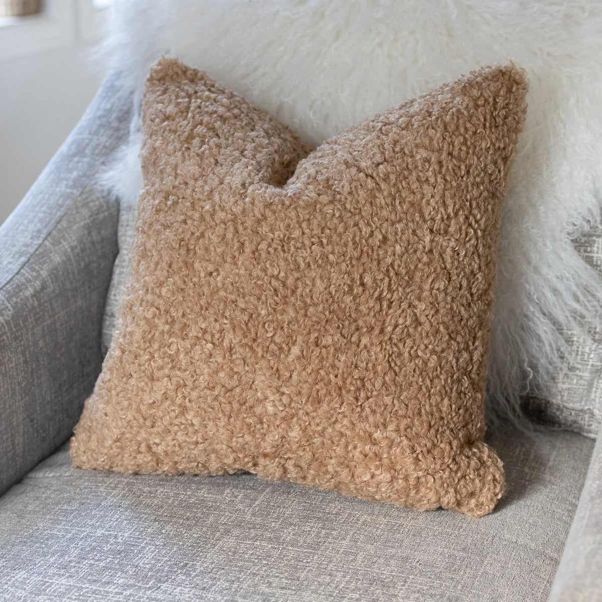 Brown textured pillow on a gray sofa