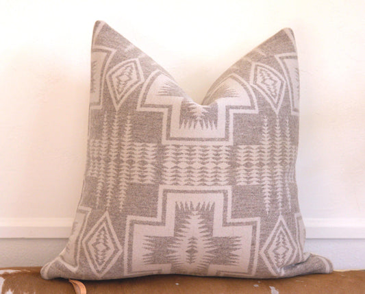 Decorative pillow with geometric pattern on a couch