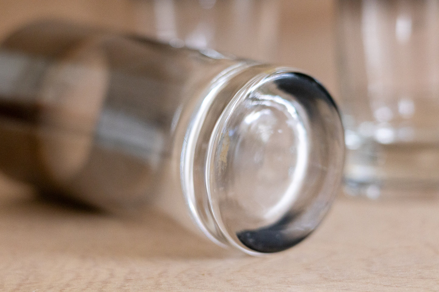 Bottom of glass on wooden surface