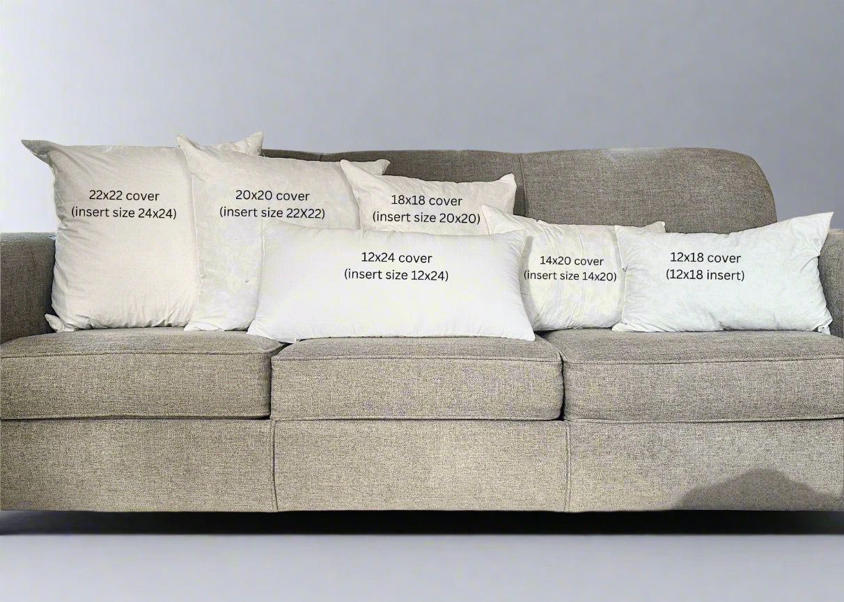 Gray sofa with decorative pillows of various sizes in a living room setting.