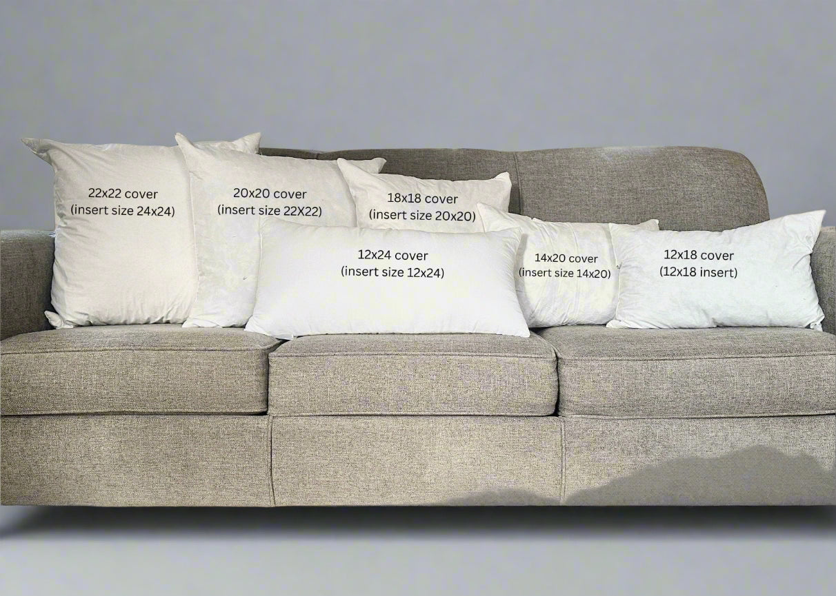 Gray sofa with white pillows of different sizes labeled on a wooden floor.