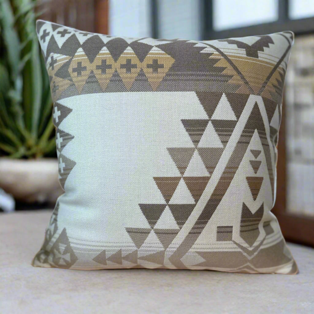 Decorative pillow with geometric pattern on a wooden surface