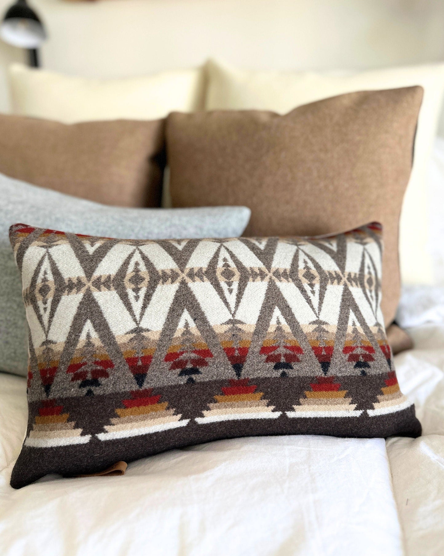 Decorative pillow with geometric pattern on a couch