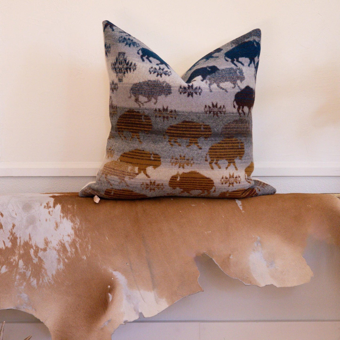 Decorative pillow with animal pattern on a wooden surface