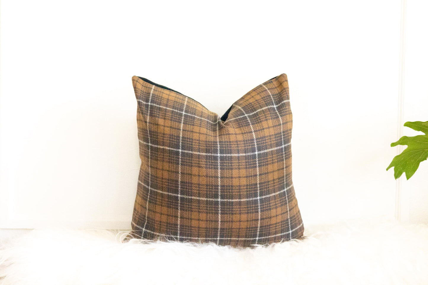Plaid pillow with a white background