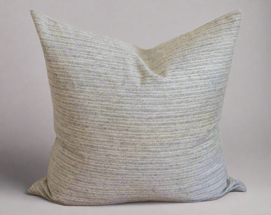Textured gray pillow on a gray background