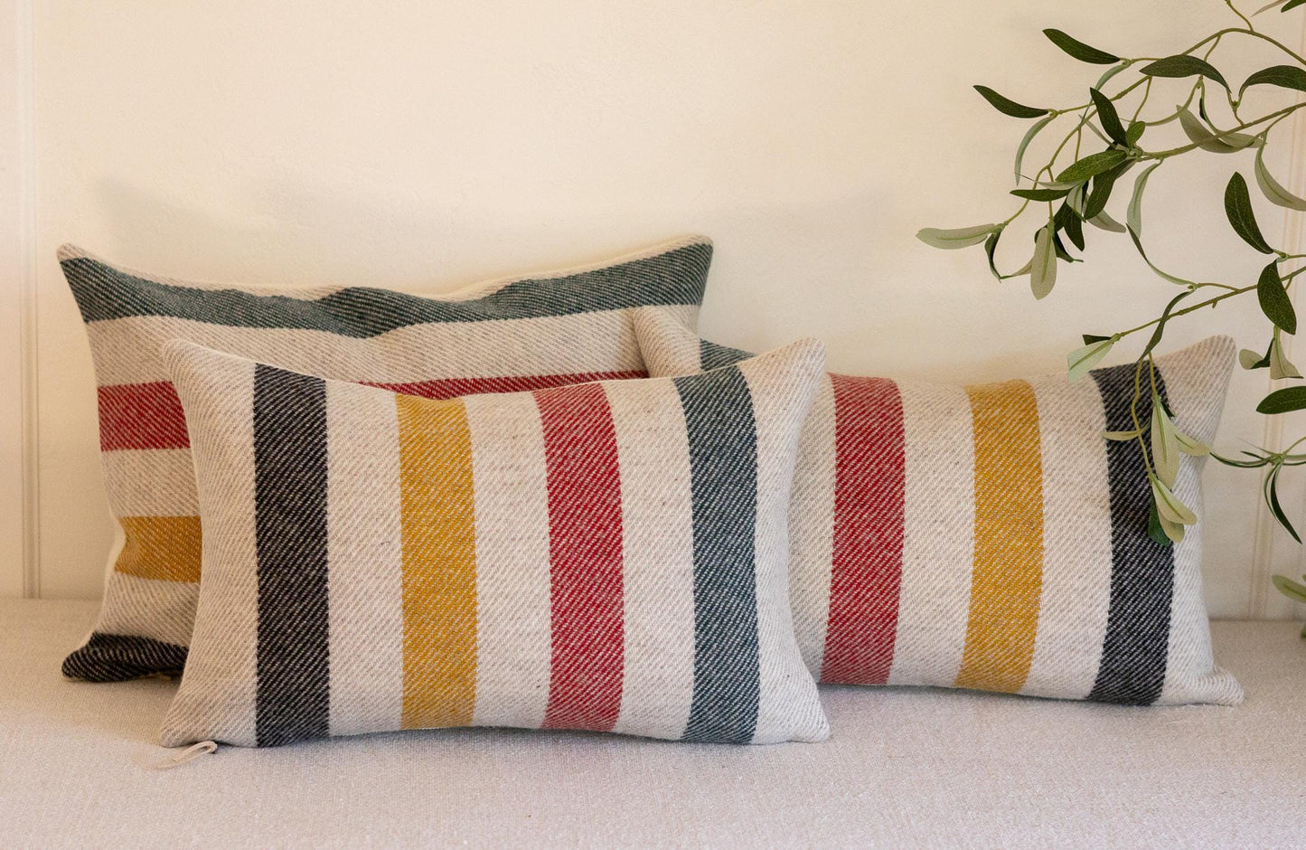 Pair of Glacier National Park Wool Lumbar Pillow Covers – White Base with Black, Red, Yellow & Green Stripes