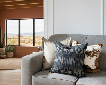 Gray sofa with patterned and textured throw pillows