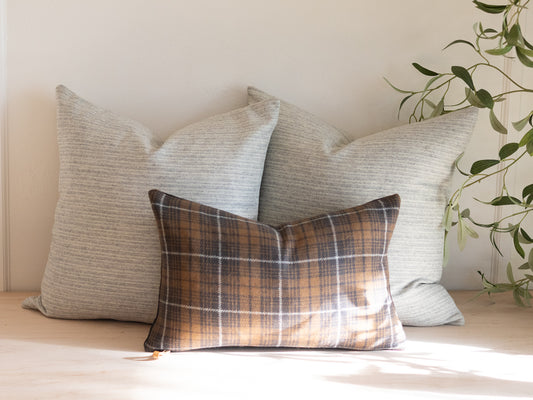 Set of 3 wool pillow covers with two neutral stripe pillows and one charcoal plaid lumbar pillow