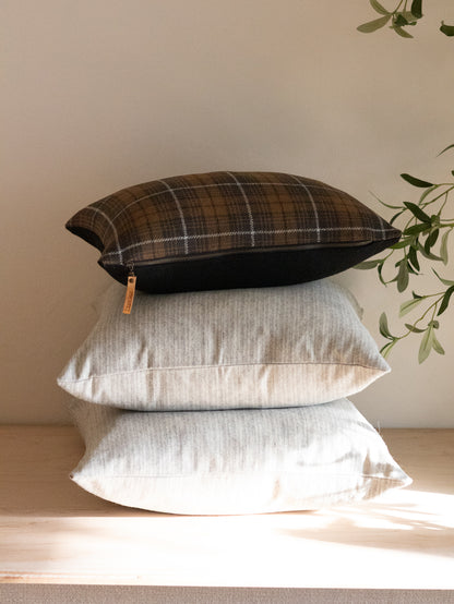 Charcoal plaid wool lumbar pillow cover side view showing zipper closure and leather pull detail