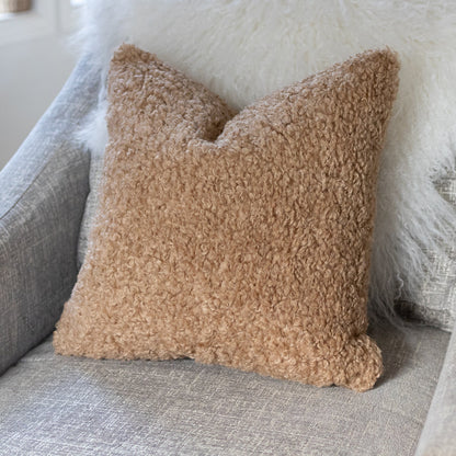 Brown textured pillow on a gray sofa