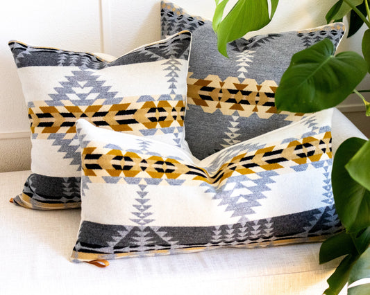 Decorative pillows with geometric patterns on a couch