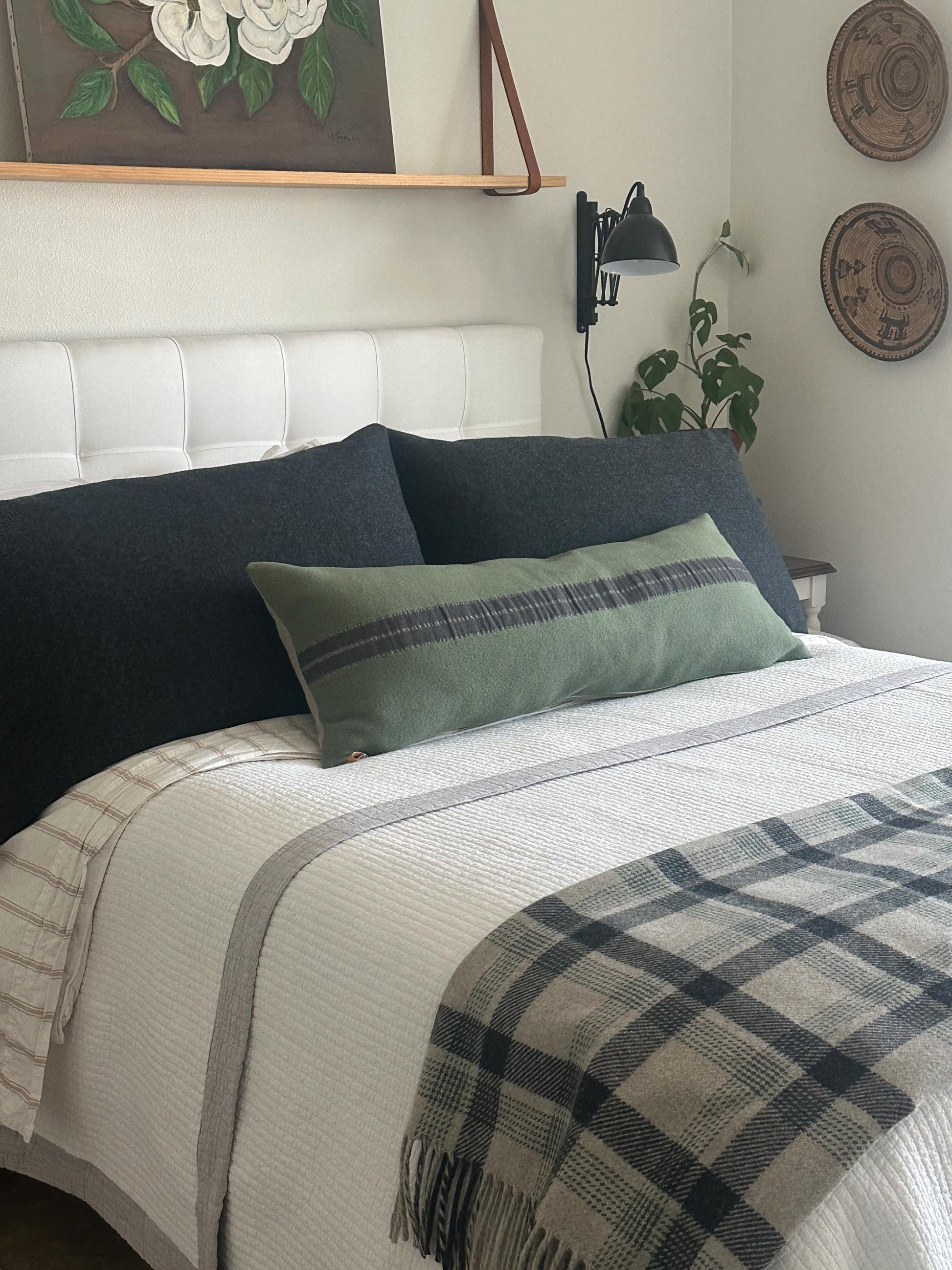 Long Green Lumbar Pillow Cover on Bed