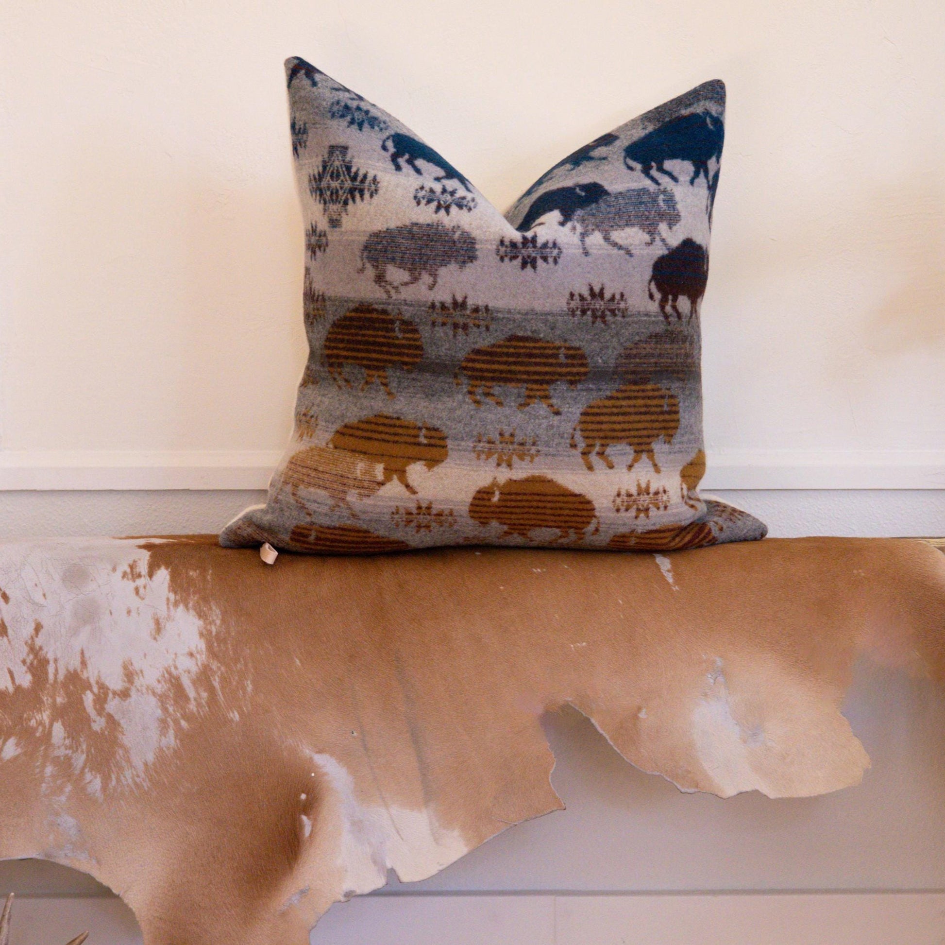 Decorative pillow with animal pattern on a wooden surface